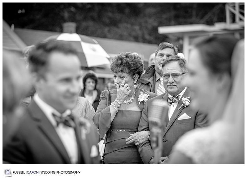 wedding guests wipes a tear