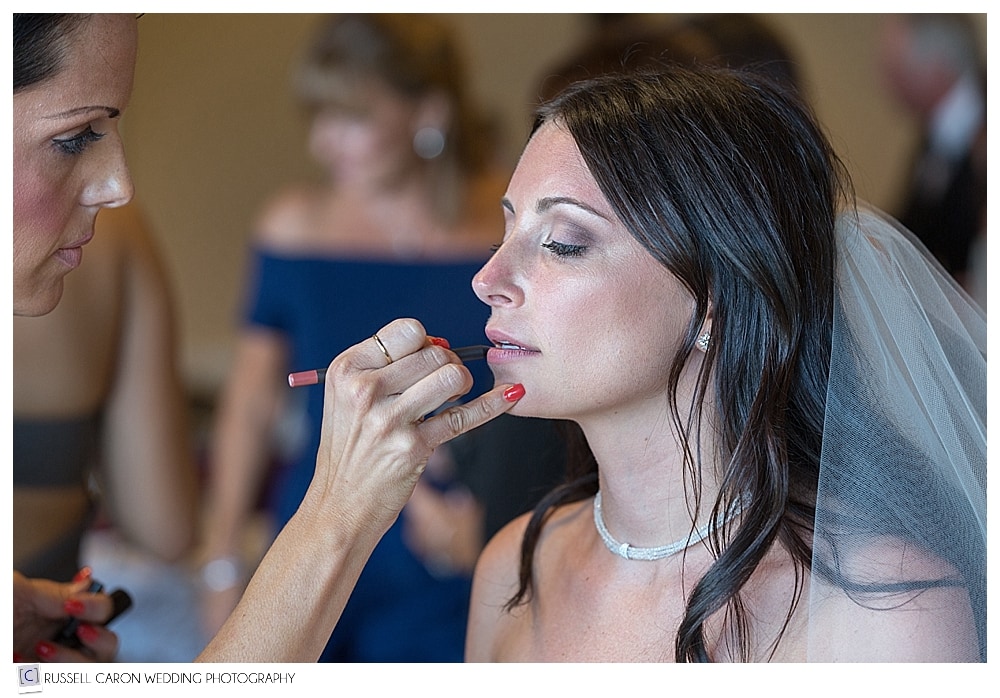 bride getting lipstick put on