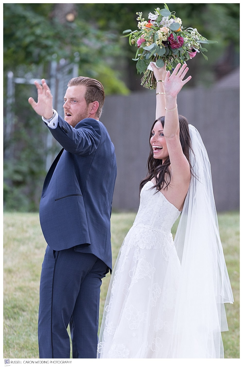 bride and groom waving
