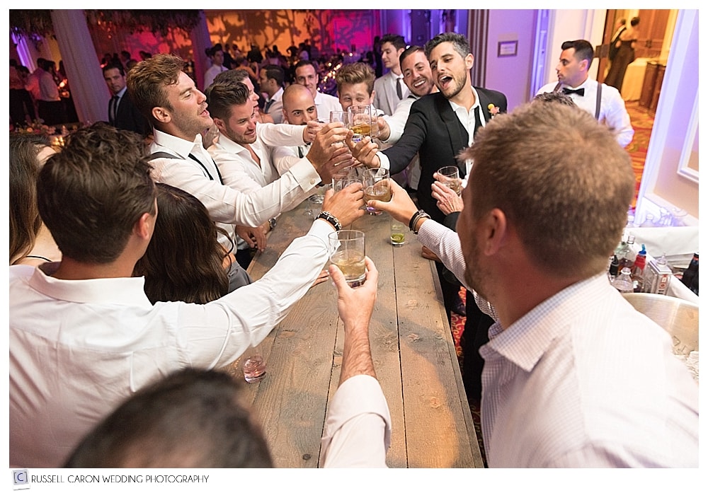 groom and groomsmen at the bar