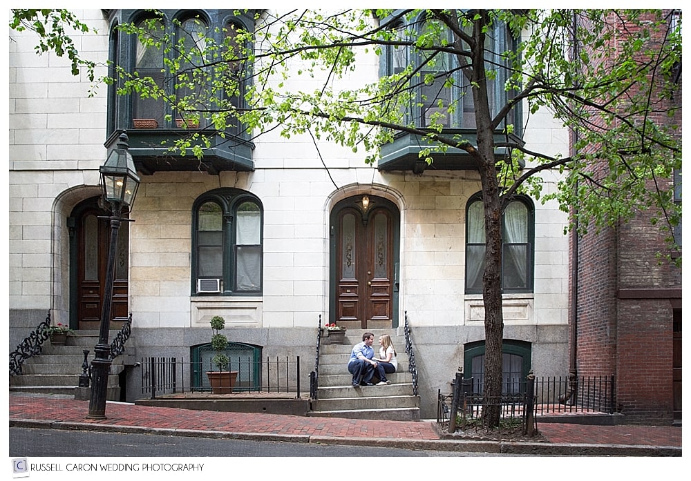couple-sitting-on-steps-in-beacon-hill-during-engagement-session