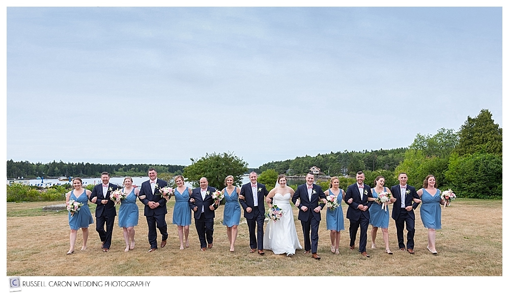 Bridal party with linked arms at Sebasco Harbor Resort, Phippsburg, Maine