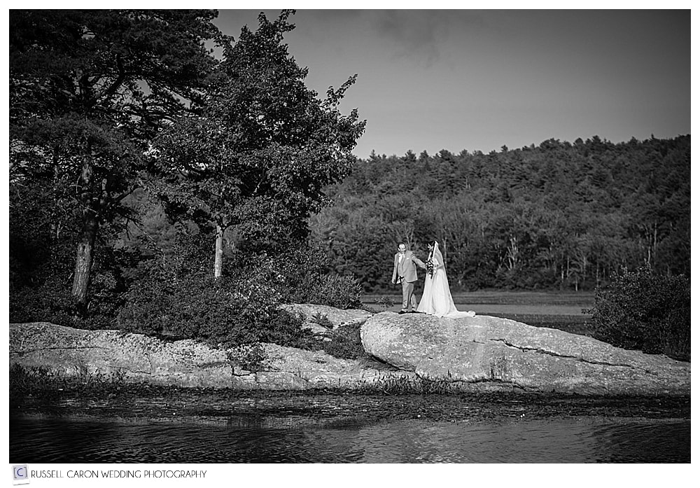 bride and groom on rock at sebasco resort wedding