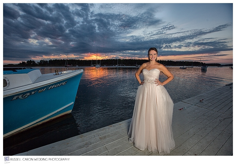 bride on sebasco resort dock at sunset