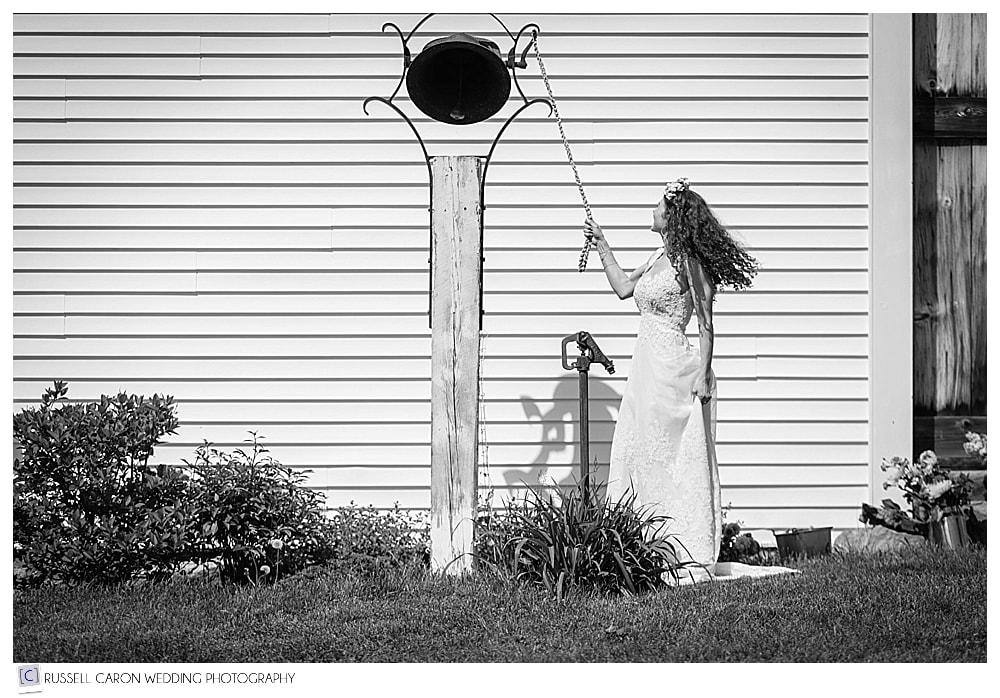 bride rings the bell at her Shady Lane Farm wedding