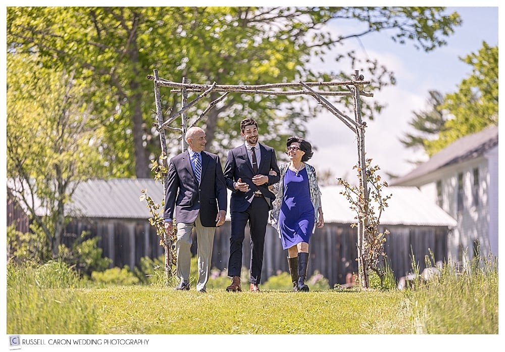 groom with parents, during Shady Lane wedding processional