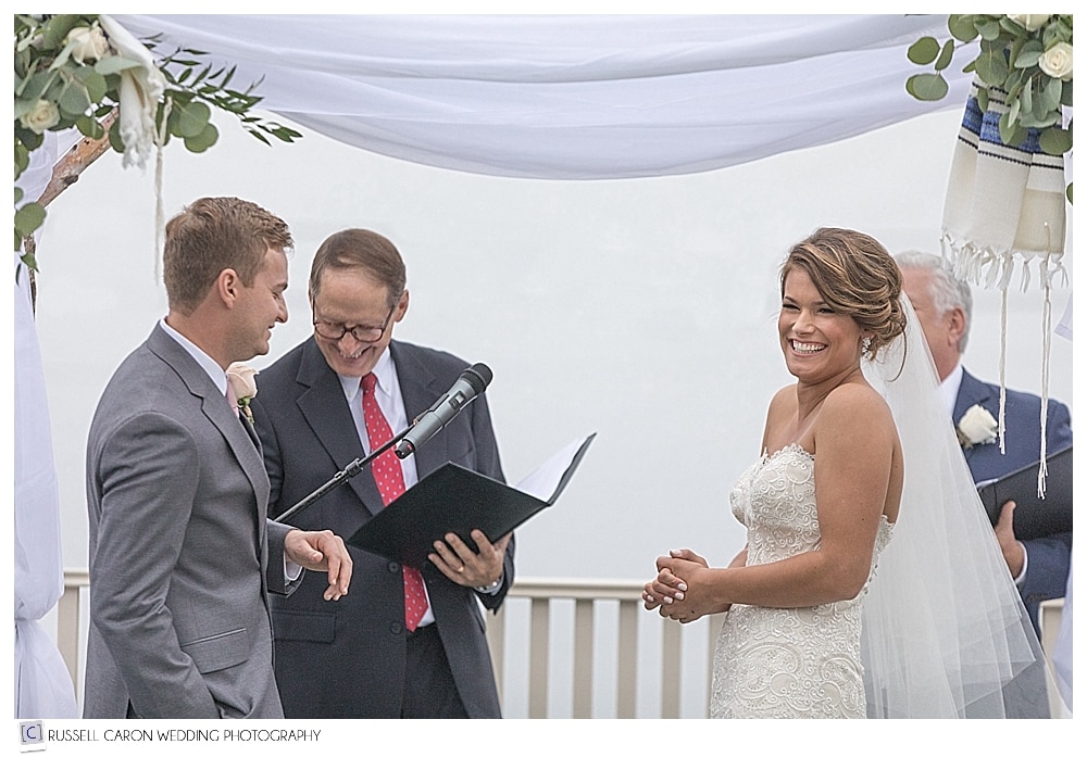 bride laughs during wedding ceremony