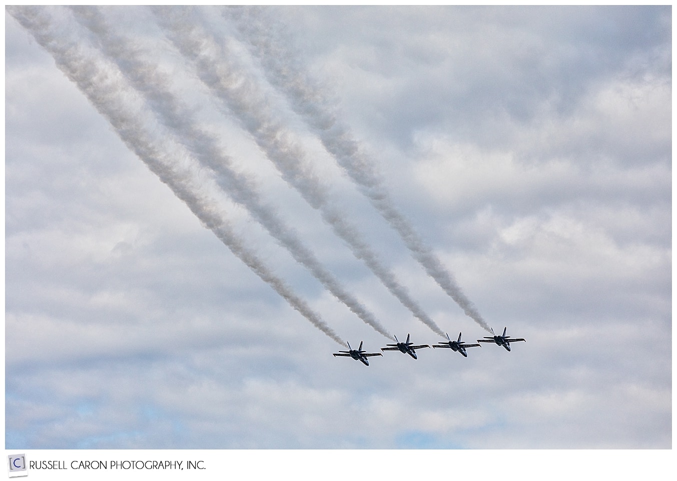 $ US Navy Blue Angels Flying in line, trailing smoke