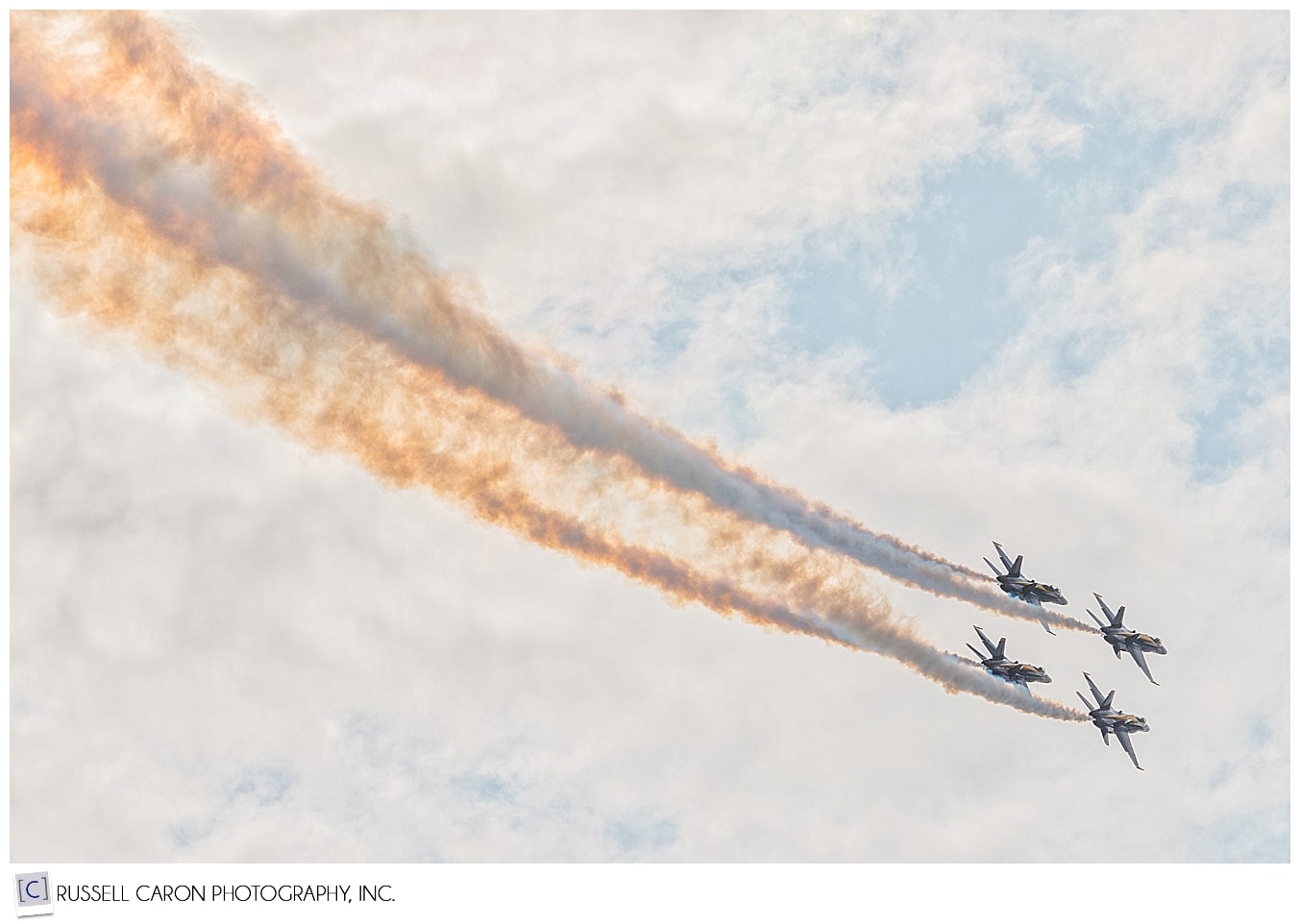 Four US Navy Blue Angels trailing smoke during the Great State of Maine Air Show in Brunswick Maine 2017