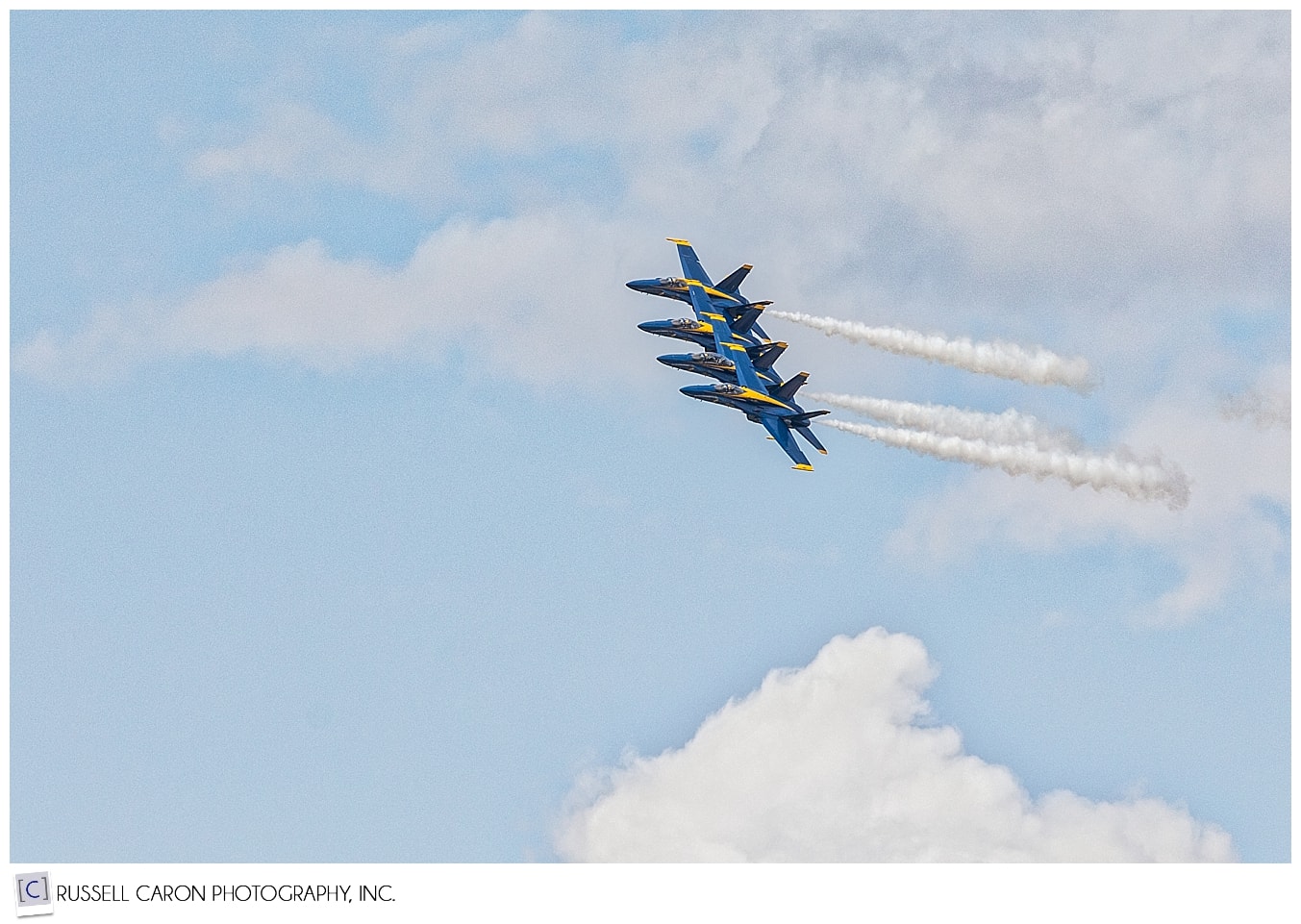 Four US Navy Blue Angels flying in formation during the Great State of Maine Air Show 2017
