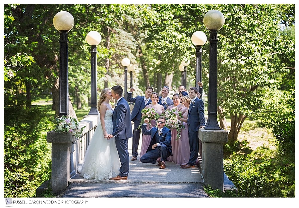 Bride and groom and bridal party, on bridge in Deering Oaks Park, Portland, Maine