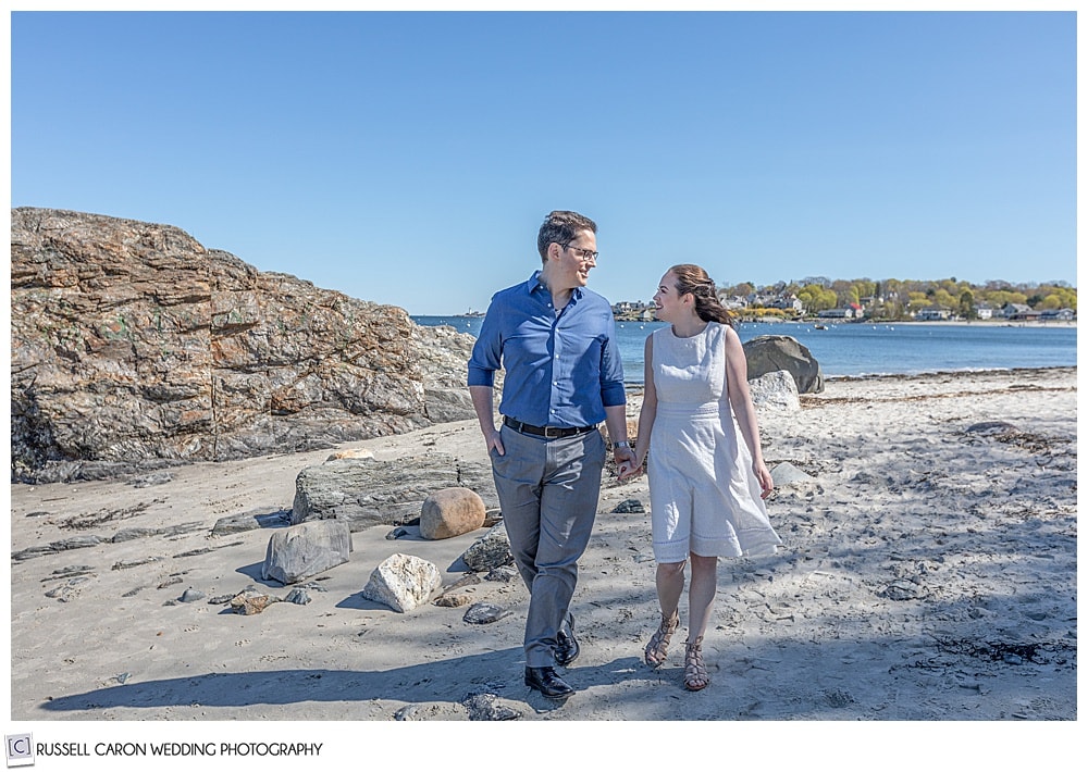 a couple walking hand in hand at willard beach in south Portland Maine