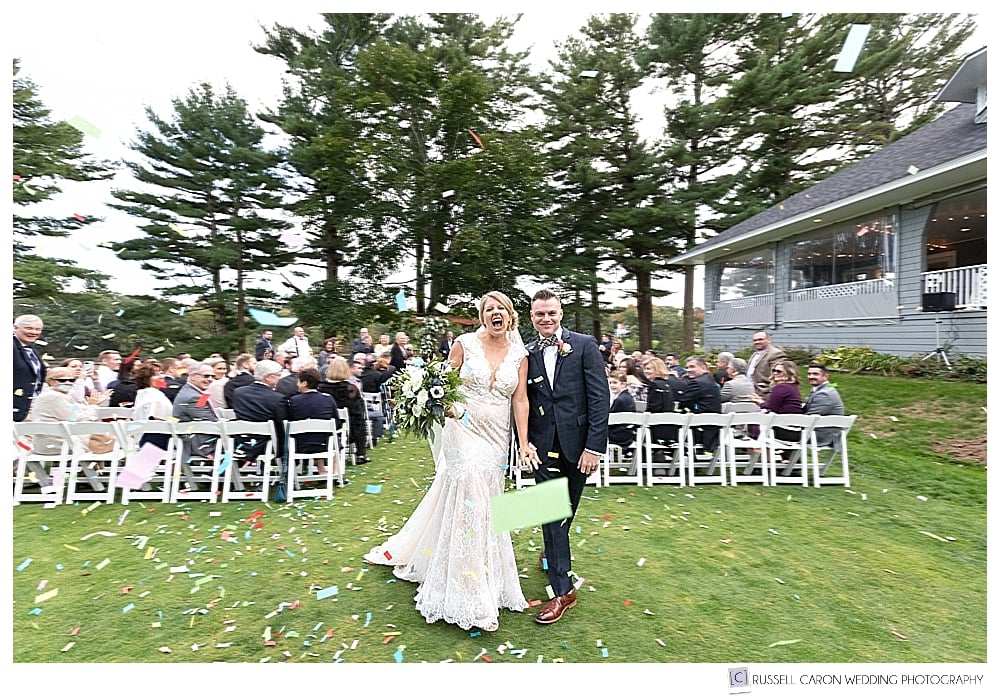 bride and groom during recessional with confetti 
