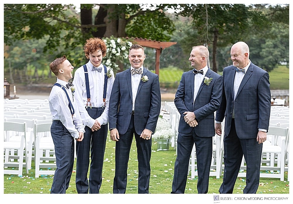 groom laughing with groomsmen