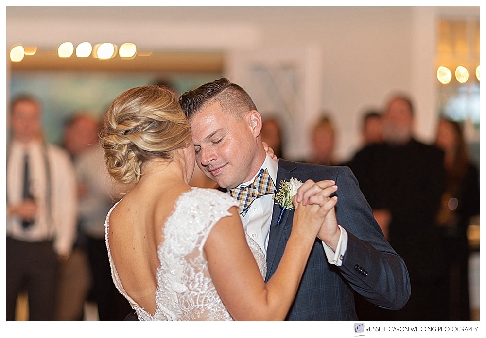 groom with eyes closed during first dance