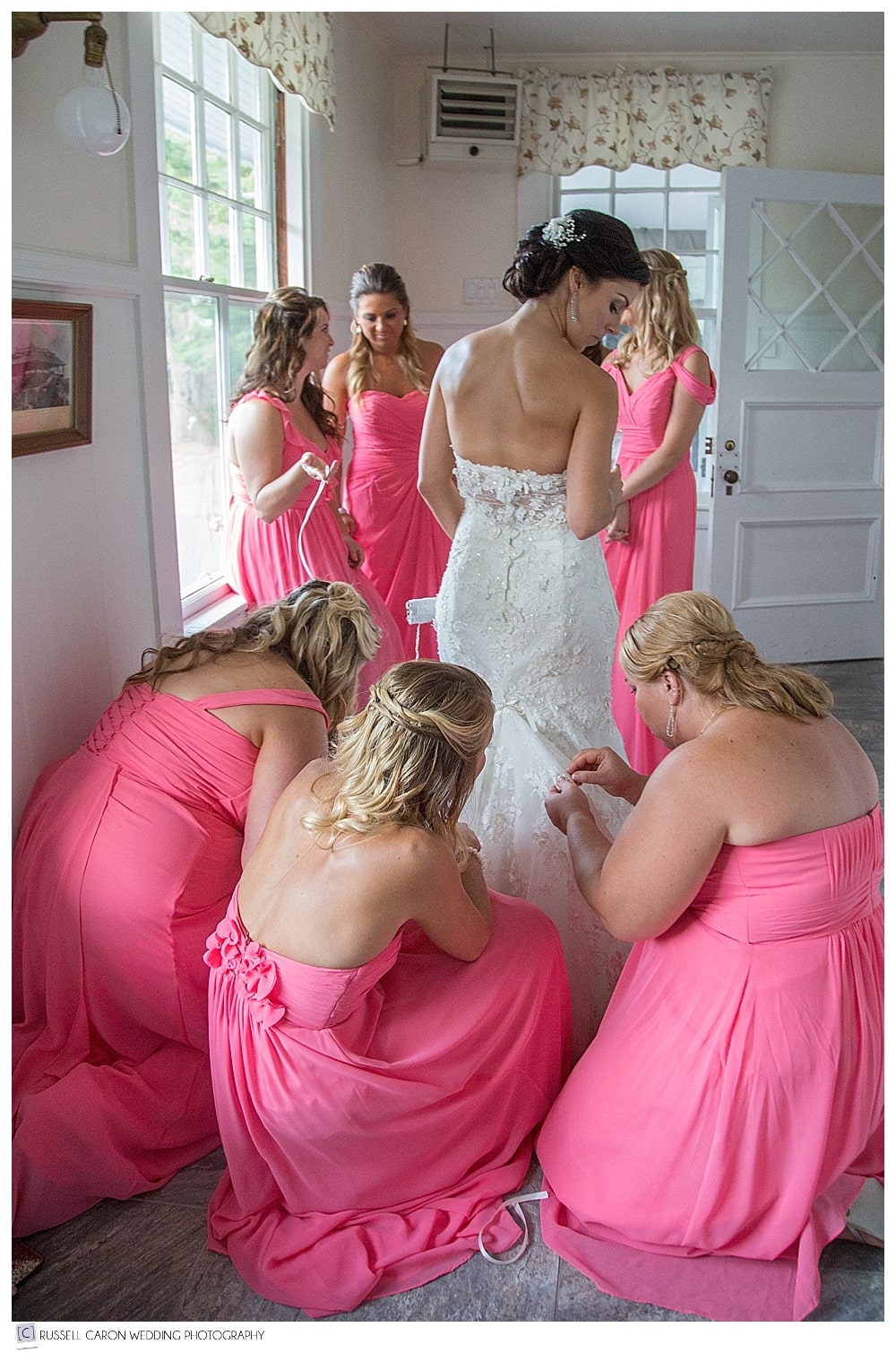 bridesmaids bustling bride's dress