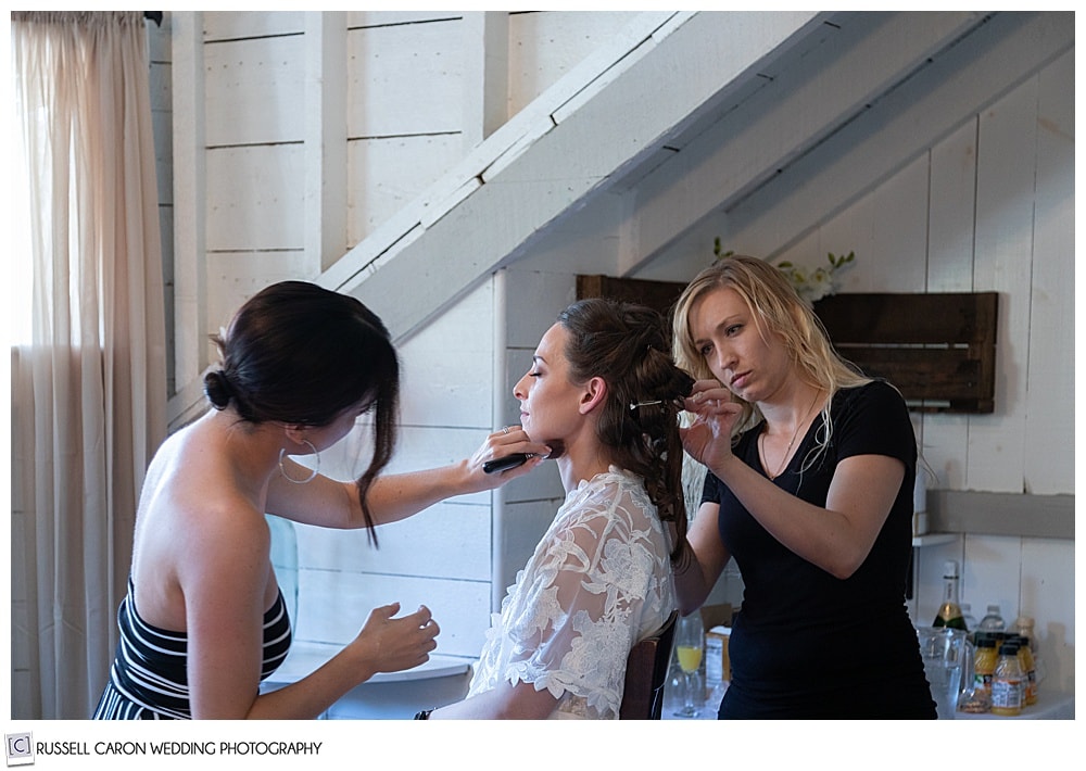 bride having her hair and makeup done