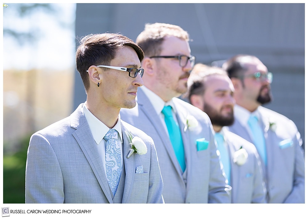 groom and groomsmen waiting for the bride