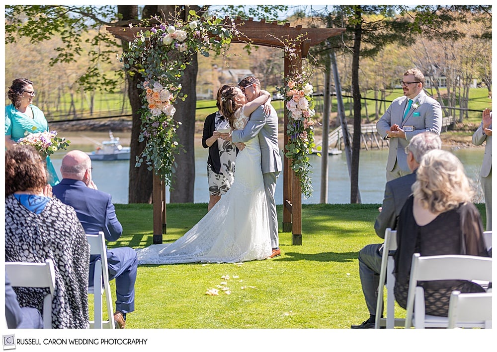 bride and groom's first kiss at their York Maine wedding