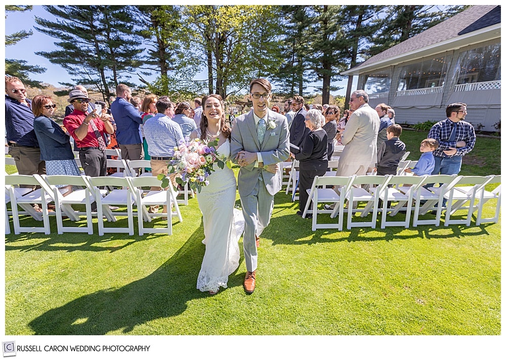 bride and groom during their recessional at the York Golf and Tennis Club, York Maine wedding