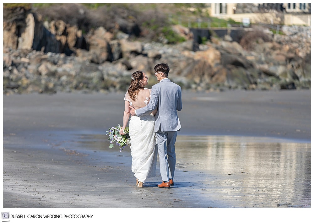 bride and groom walking on York Harbor Beach, York Harbor, Maine