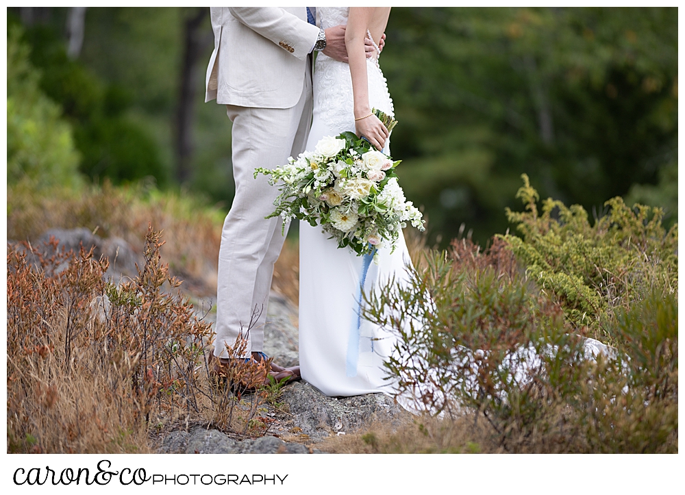 bride and groom together, with a white, green, yellow, and pink Bad Rabbit Flowers bouquet at a Grey Havens Inn wedding, Georgetown Maine