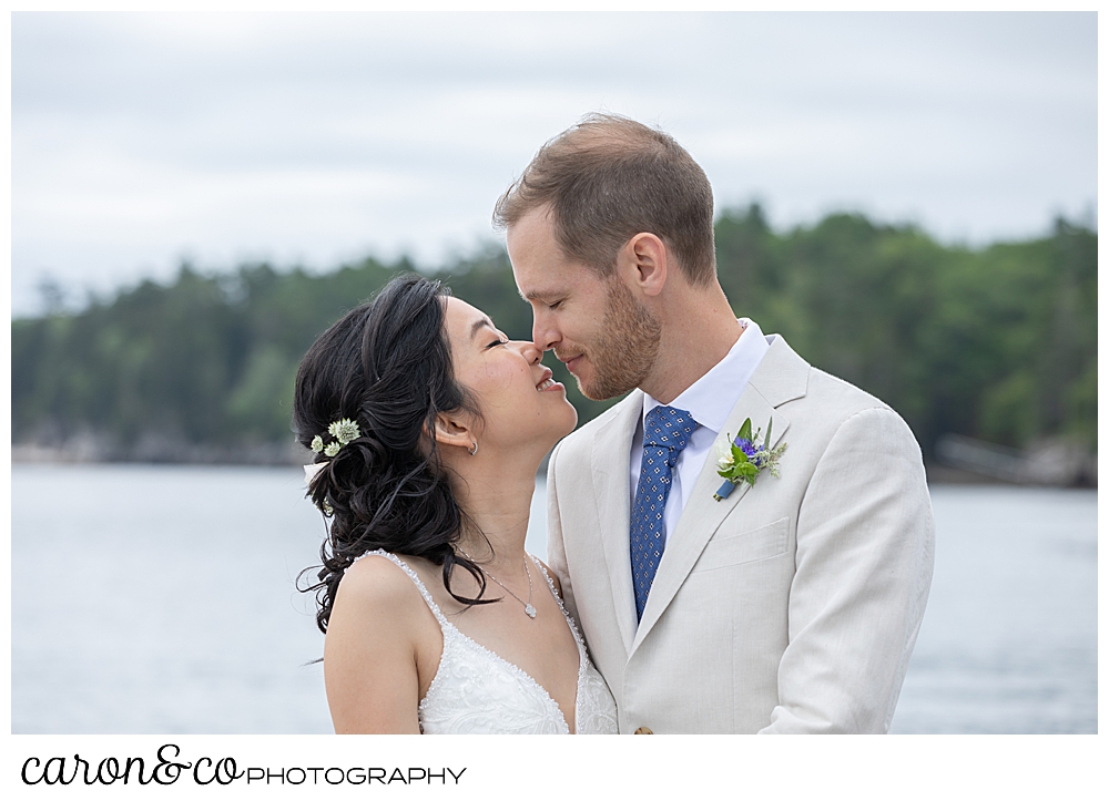 bride and groom kissing at a Grey Havens Inn wedding, Georgetown Maine