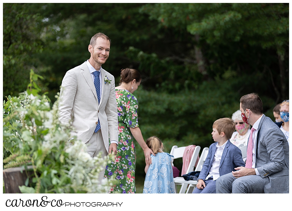 groom waits for his bride during a Grey Havens Inn wedding ceremony, Georgetown Maine