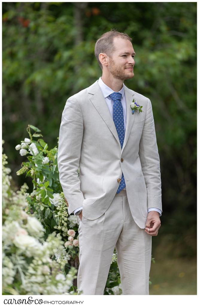 Groom watches as his bride walks down the aisle at a Grey Havens Inn wedding ceremony, Georgetown Maine