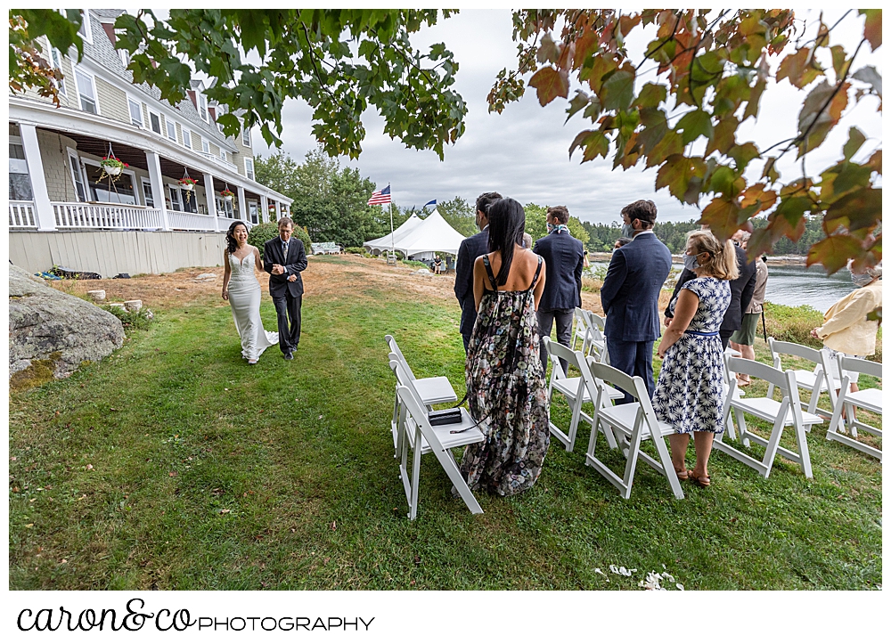 bride approaching the aisle at an outdoor Grey Havens Inn wedding ceremony, Georgetown Maine