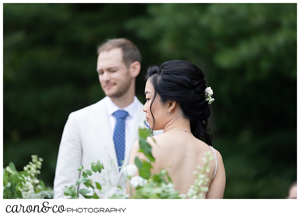 bride and groom during a Grey havens Inn wedding ceremony on the lawn, Georgetown Maine