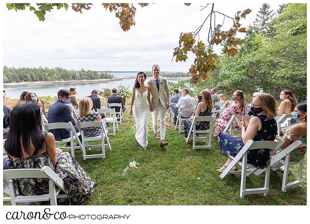 bride and groom during recessional at their Grey Havens Inn wedding, Georgetown Maine