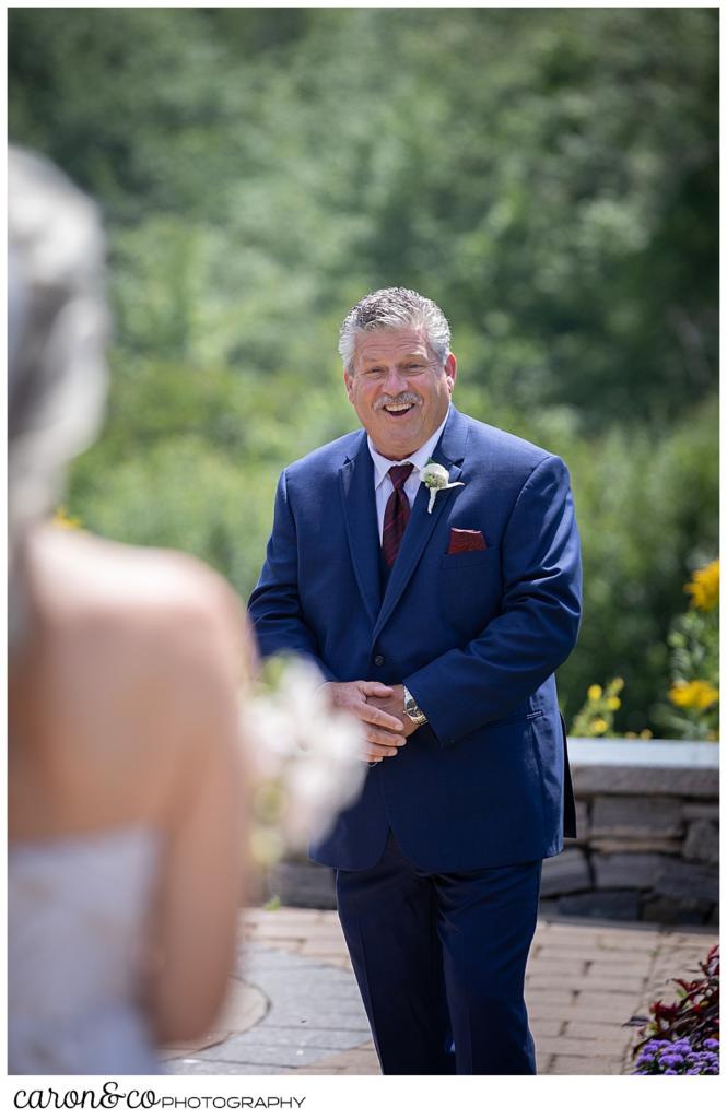 groom turning around to see his bride during their wedding day first look