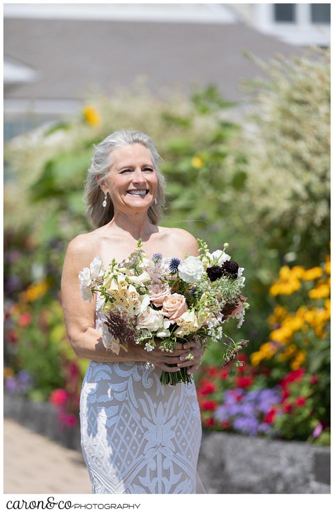 bride smiles at her husband during a wedding day first look