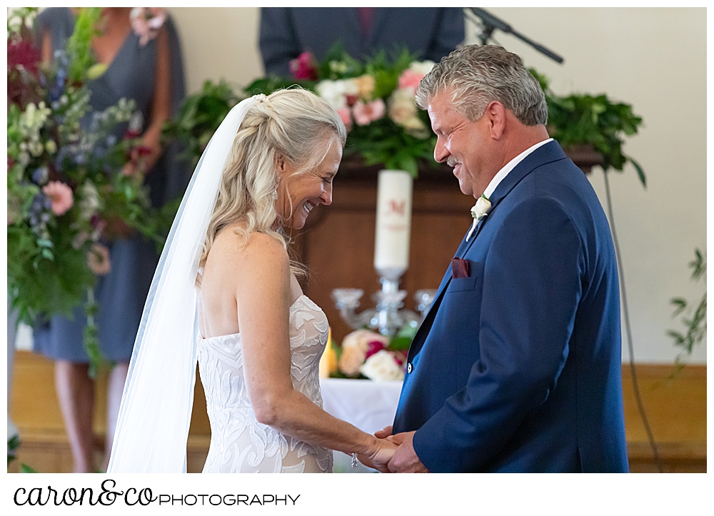 bride and groom smiling during their spurwink church cape elizabeth maine wedding ceremony