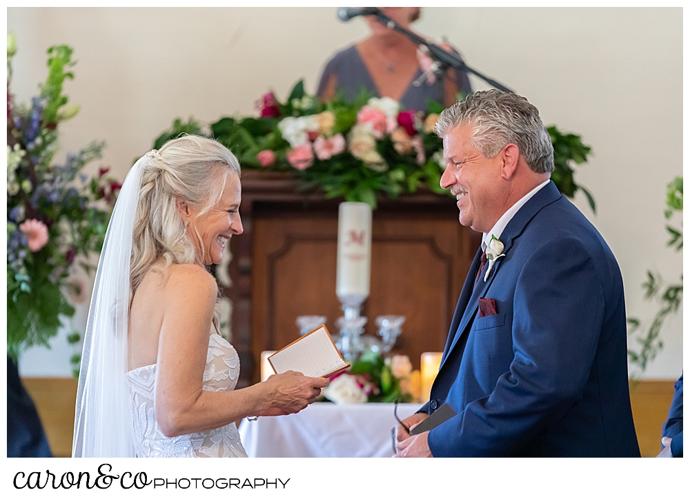 bride and groom laughing during their spurwink church cape elizabeth maine wedding ceremony