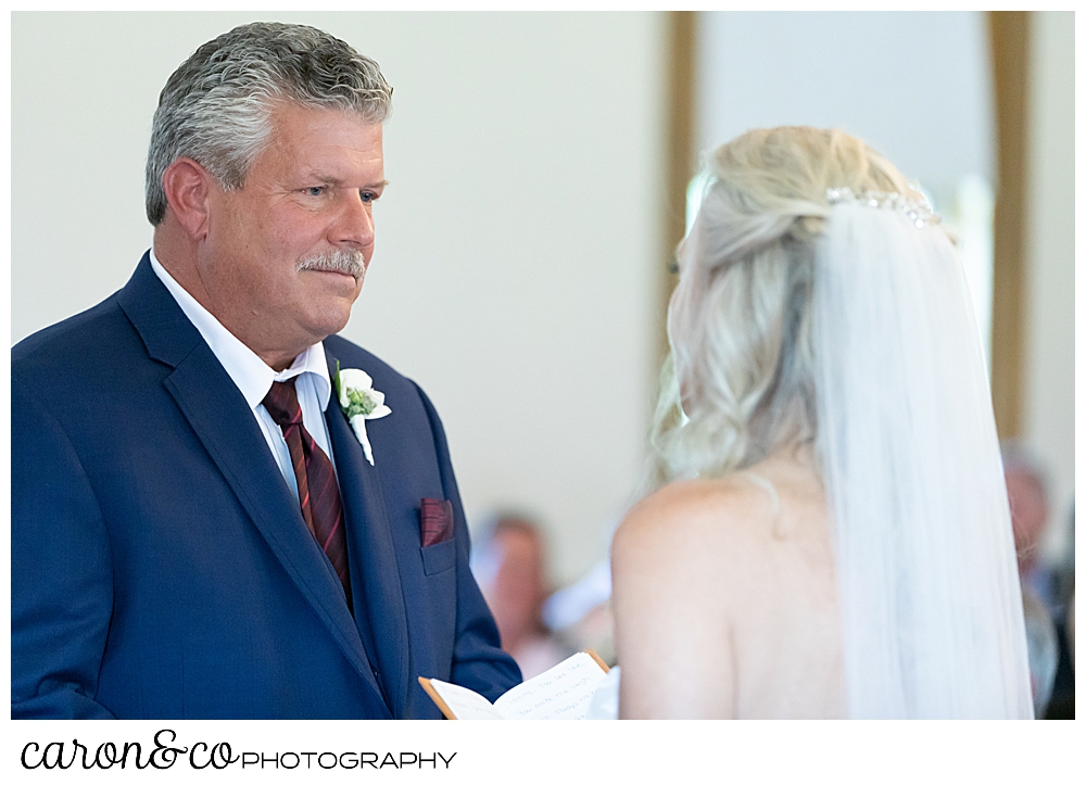 groom looking at his bride during their spurwink church cape elizabeth maine wedding ceremony