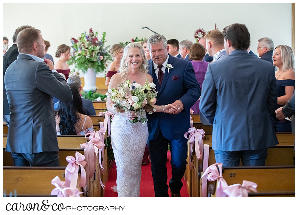 bride and groom during the recessional at the spurwink church cape elizabeth maine wedding ceremony