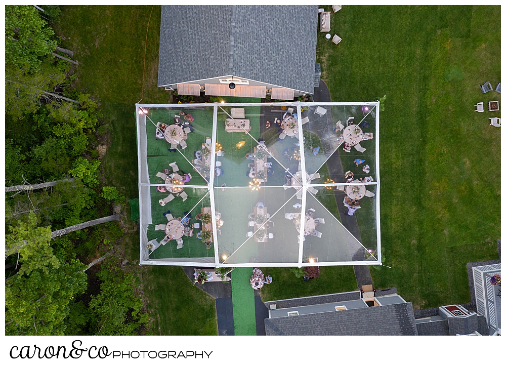 maine drone wedding photo of a backyard reception with a clear tent in a Scarborough Maine wedding 