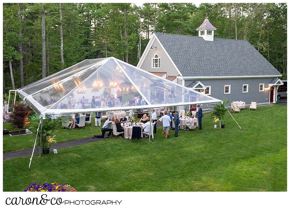 Maine drone wedding photo of a backyard wedding, with a clear tent in Scarborough Maine wedding reception