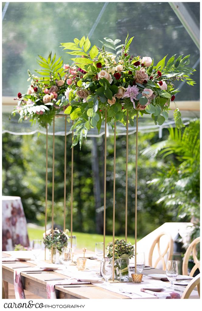 beautiful floral arrangement at a scarborough maine wedding tented reception