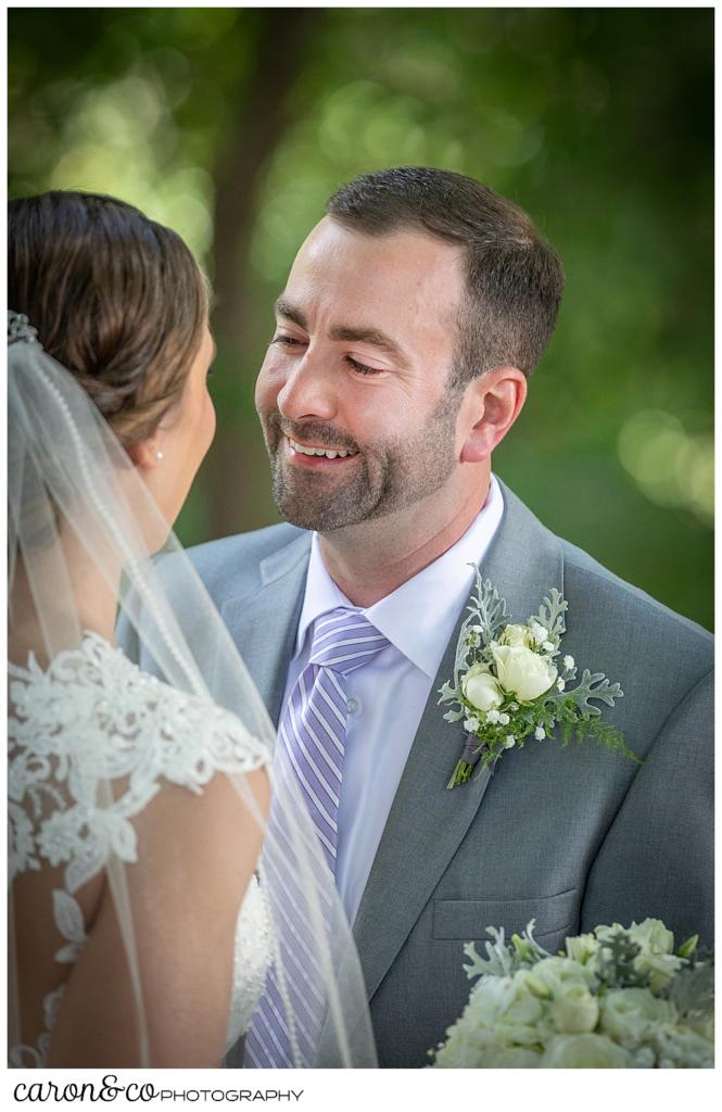 sweet summertime wedding day first look, groom reaches bride, smiling