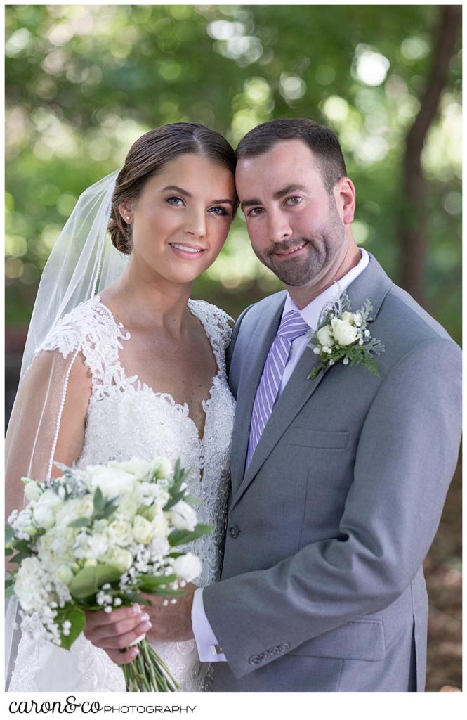 sweet summertime wedding day portrait of a bride and groom