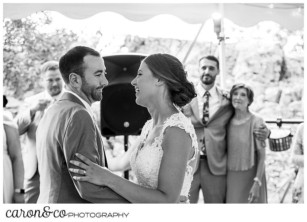 sweet summertime wedding reception, black and white photo of the bride and groom dancing