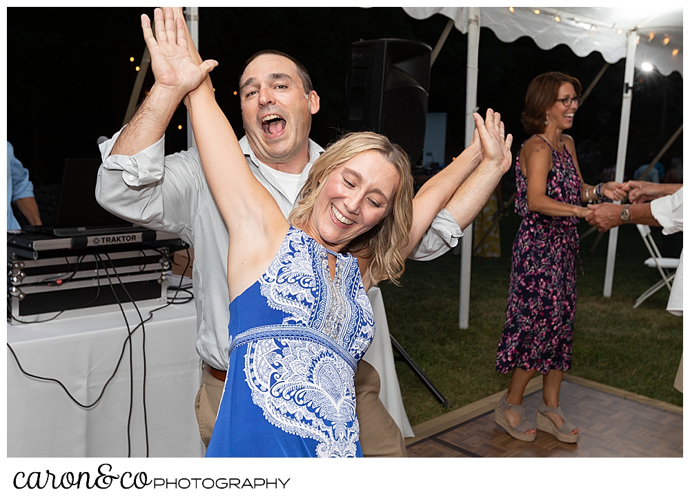 sweet summertime wedding reception photo of guests dancing