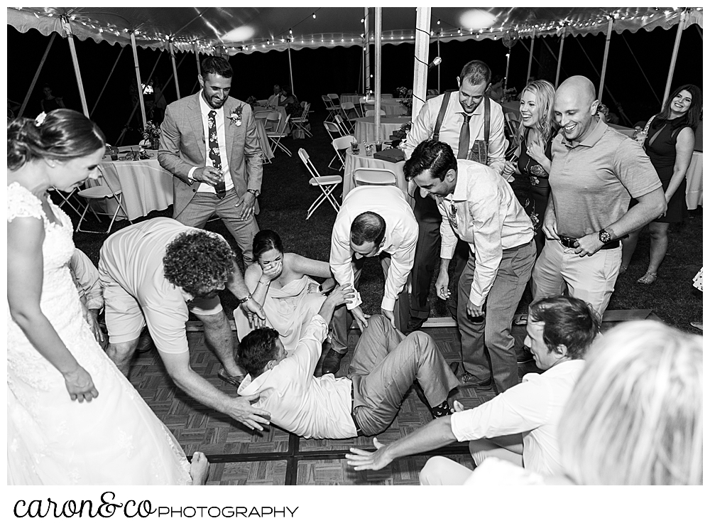 sweet summertime wedding reception black and white photo of guests dancing