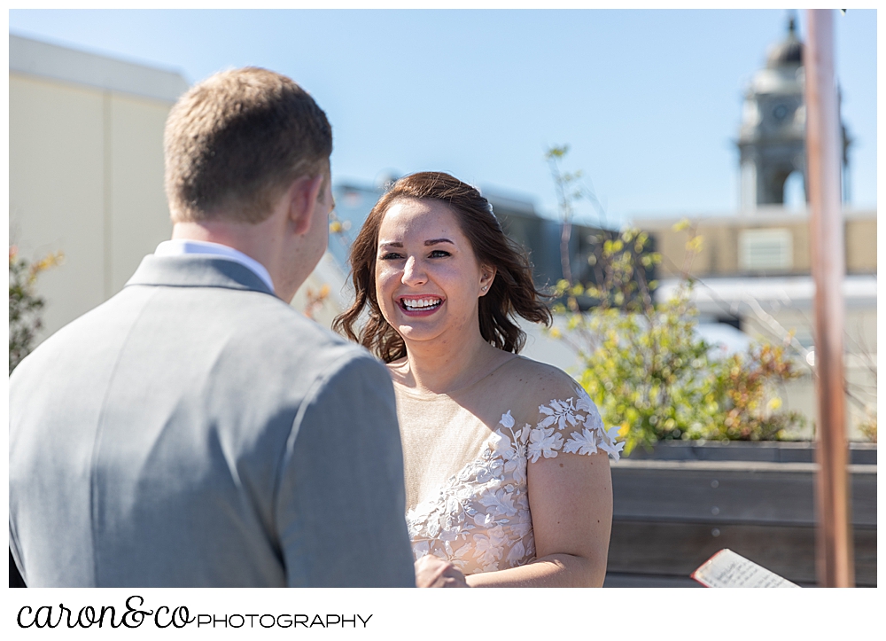 bride smiles at her groom on the rooftop at a Portland Press Hotel wedding