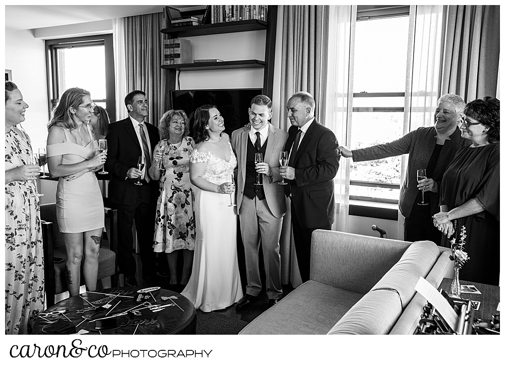 black and white photo o a bride and groom socializing with their guests at their Portland Press Hotel wedding