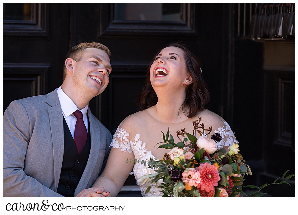 bride and groom laughing together