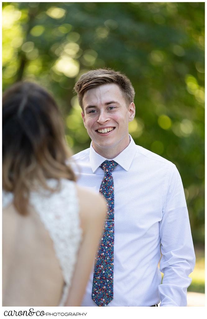 groom reaches bride during wedding day first look